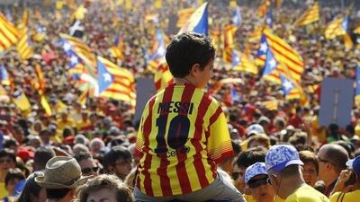 A little boy in a Lionel Messi shirt attends a Catalonia National Day celebration in Barcelona on September 11, 2014. Quique Garcia / AFP