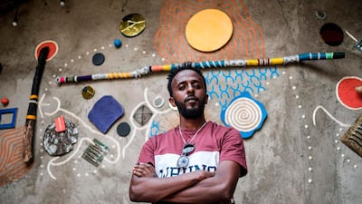 Eritrean painter Noah Mulubrhan, 35, is portrayed in local gallery in Addis Ababa. AFP