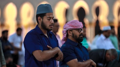 Isha prayers held at the mosque. Victor Besa / The National