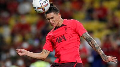 Liverpool striker Darwin Nunez heads the ball. EPA