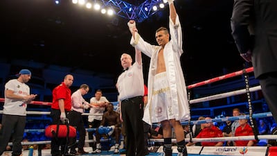 Malik Zinad has his hand raised after beating Jermaine Asare at the Motorpoint Arena in Cardiff in 2017. Alamy