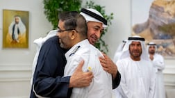President Sheikh Mohamed embraces flydubai pilot Smit Machchhar, during a reception for him and other crew members of Flight 1073 in Abu Dhabi on October 27. UAE Presidential Court