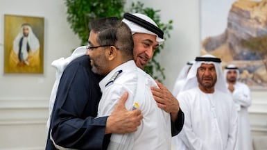 President Sheikh Mohamed embraces Capt Smit Machchhar at a reception held in Abu Dhabi. UAE Presidential Court