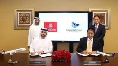 Sheikh Ahmed bin Saeed, chairman and chief executive of Emirates, and Kartika Wirjoatmodjo, Deputy Minister in Indonesia's Ministry of State-Owned Enterprises, watch as executives from Emirates and Garuda sign the codeshare deal. Photo: Emirates