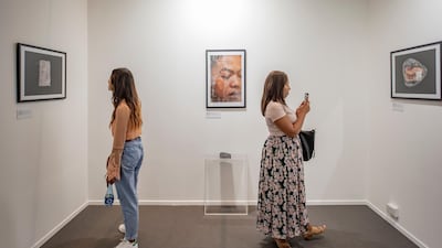 Visitors at the Campus Art Dubai exhibition during Art Dubai 2019. Photo Solutions