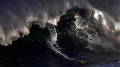 A surfer rides a large wave at El Bocal during the Vaca Gigante (Big Cow) competition in Santander, northern Spain. Vincent West / Reuters