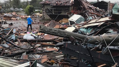 A man walks through debris of damaged houses by a tornado caused by typhoon Hagibis in Ichihara, Chiba Prefecture, east of Tokyo. EPA
