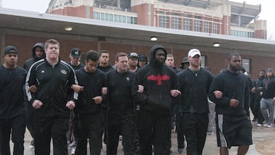The University of Oklahoma football team and coaches line up wearing all black in the Everest Training Center in protest against the Sigma Alpha Epsilon fraternity which was banned from campus after several members of the fraternity took part in a racist chant caught on video. Tulsa World, Nick Oxford/AP Photo
