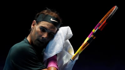 Rafael Nadal towels down in between points. Reuters