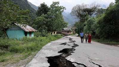 Cracks in the road caused by flash floods in Naga-Namgor village, Sikkim, India. Reuters