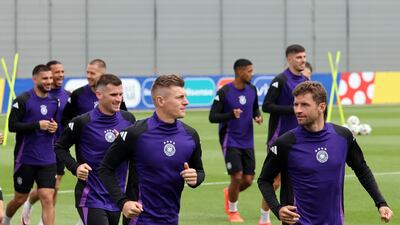 German players Toni Kroos, centre, and Thomas Muller, right, train ahead of their quarter-final against Spain. EPA