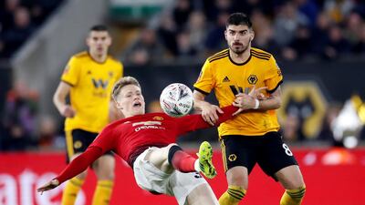 Manchester United's Scott McTominay in action with Wolverhampton Wanderers' Ruben Neves during thei FA Cup quarter-final at Molineux. Wolves won the match 2-1. Reuters