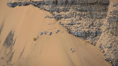 People compete in the stage 5 of the 34rd edition of the Marathon des Sables between El Borouj and Tisserdimine in the southern Moroccan Sahara desert, on April 12, 2019. The 34rd edition of the marathon is a live stage 250 kilometres race through a formidable landscape in one of the world's most inhospitable climates. AFP