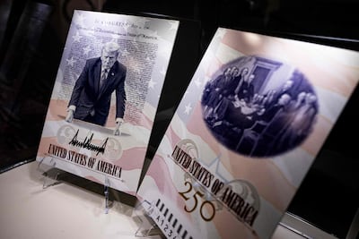 A design for the new Trump-themed commemorative US passport is displayed on the National Mall. Getty Images via AFP