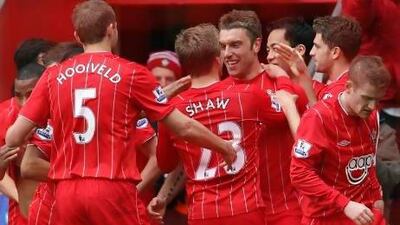 Southampton's Rickie Lambert, center, celebrates his goal against Chelsea with teammates during their English Premier League soccer match at St Mary's stadium, Southampton, England, Saturday, March 30, 2013. (AP Photo/Sang Tan) *** Local Caption *** Britain Soccer Premier League.JPEG-02c0e.jpg