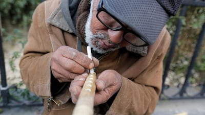 Saad Attab, 58, an Iraqi from Samarra city, makes a flute on a street in Damascus, Syria. Attab sought safe haven in Damascus in 2003 with the US invasion of Iraq. EPA