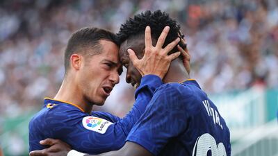Vinicius Junior (R) celebrates with Real Madrid's Spanish forward Lucas Vazquez. AFP