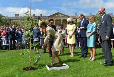 Prince William and Catherine Duchess of Cambridge plant a tree at the Royal Garden Party at Hillsborough Castle Annual Garden Party in Hillsborough Castle, Northern Ireland, in June 2016. Shutterstock