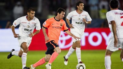 Lionel Messi, centre, was the main draw at the Fifa Club World Cup at Zayed Sports City in 2009. Andrew Henderson For The National
