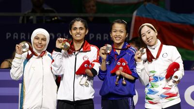 From left: Silver medalist Ziyodakhon Isakova from Uzbekistan, gold medalist Leonor Angelica Espinoza Carranza from Peru, co-bronze medalist Khwansuda Phuangkitcha of Thailand, and co-bronze medalist Zakia Khudadadi, from Afghanistan and part of the Paralympic Refugee team, celebrate after the Para Taekwondo K44-47kg class competition. AP