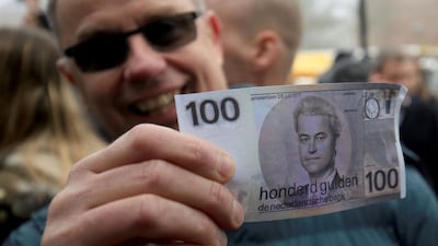 A supporter with a fake 100 guilder note depicting the Dutch rightwing populist and leader of the Partij voor de Vrijheid (Party for Freedom, PVV) Geert Wilders at a meeting of Wilders supporters in Spijkenisse, Netherlands, on February 18, 2017. AP
