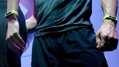 Models wear iFit monitors during a performance at the iFit booth. iFit’s Coach App gathers information from iFit’s many wearables, furniture and exercises equipment to monitor exercise, activity, nutrition and sleep to give personalised recommendations. Robyn Beck / AFP