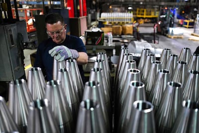 An employee handles 155mm calibre shells after the manufacturing process at the Scranton Army Ammunition Plant in Pennsylvania. AFP