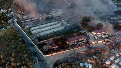 Fire burns container houses and tents in the Moria refugee camp on the northeastern Aegean island of Lesbos, Greece. AP Photo