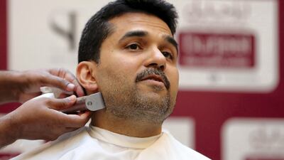 Dr. Vayalil doing a Movember shave.