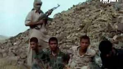 Footage broadcast last year on Al Arabiya allegedly shows an Iranian Jundallah fighter with a rifle standing over kidnapped Iranian security workers.