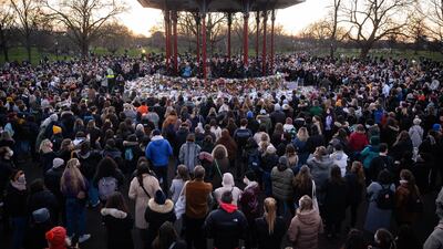 People gather to lay flowers and pay their respects to Sarah Everard, at Clapham Common bandstand, London. Getty Images