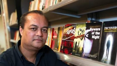 Joygopal Podder admits that he visits bookstores to see his work on display. Simon De Trey-White for The National.