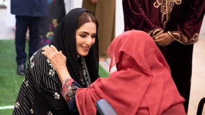 Sayyida Al Busaidiyah talks to an elderly woman at the Al Rustaq care home. AFP