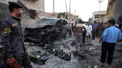 Security forces inspect the scene of a car bomb attack in Basra, 550 kilometres southeast of Baghdad.