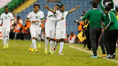 Saudi Arabia footballers celebrate a goal during the 2014 Gulf Cup of Nations in Riyadh. Anas Kanni / Al Ittihad / November 23, 2014