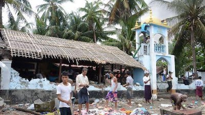 Human Rights Watch says this photo shows Rakhinese dismantling and looting the site of a destroyed mosque after ethnic violence in Sittwe, Rakhine state.