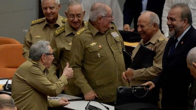 In this photo taken on December 21, 2019, Cuban Communist Party leader, Raul Castro, left, gives the thumbs-up to newly appointed Prime Minister Manuel Marrero Cruz, right. Cuba's ruling Communist Party will hold a congress from April 16 to 19, at the end of which Miguel Diaz-Canel will become its leader, replacing Mr Castro who is retiring. AFP