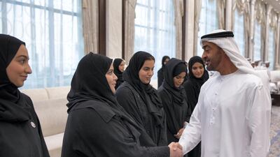 Sheikh Mohamed bin Zayed (right), receives members of Ministry of Presidential Affairs, during an iftar reception at Abu Dhabi's Al Bateen Palace.