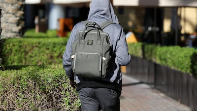Residents wore hoodies on their way to work on Sunday morning. Chris Whiteoak / The National