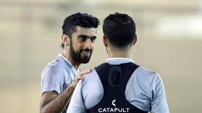 UAE's Hamdan Al Kamali, left, training at Al Wasl Sports Club, Dubai, before their upcoming World Cup qualifier against Indonesia . Chris Whiteoak / The National