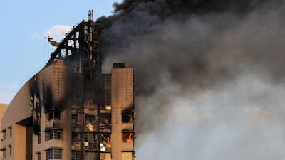 Smoke rises from a high-rise building following a drone attack in Kuwait City last week. AFP