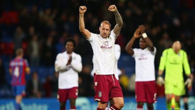 Alan Hutton of Aston Villa thanks his team's supporters following their 1-0 Premier League win over Crystal Palace at Selhurst Park on Tuesday. Ian Walton / Getty Images
