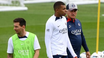 PSG manager Christophe Galtier with Kylian Mbappe and Lionel Messi during a training session. AFP