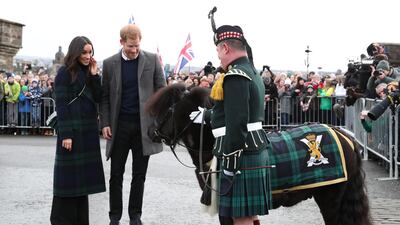 Prince Harry and Meghan Markle meet Pony Major Mark Wilkinson and regimental mascot Cruachan IV during a walkabout at Edinburgh Castle on February 13, 2018 in Edinburgh, Scotland. Getty Images