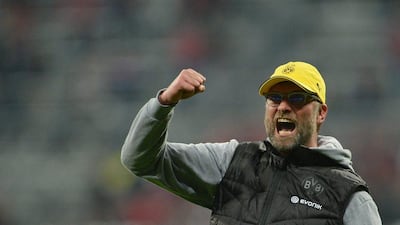 Borussia Dortmund coach Juergen Klopp celebrates after the penalty shootout against Bayern Munich to send his side to the DFB-Pokal Final on Tuesday. Peter Kneffel / EPA / April 28, 2015