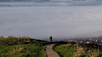 Early morning mist lingers below Glastonbury Tor as the sun rises over Somerset in the UK. Matt Cardy/Getty Images