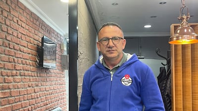 Gungor Sivri, a Kasimpasa resident and supporter of Turkish President Recep Tayyip Erdogan, in his salon. Holly Johnston for The National