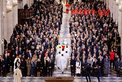 Archbishop of Paris, Laurent Ulrich leads clergy as they walk down the central isle of Notre-Dame Cathedral at the end of a ceremony to mark the re-opening of the landmark cathedral in Paris, December 7, 2024. REUTERS