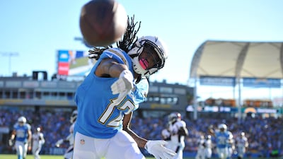 Los Angeles Chargers wide receiver Travis Benjamin throws the football after scoring a touchdown during the second half against the Denver Broncos at StubHub Center. Orlando Ramirez / USA TODAY Sports