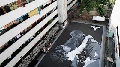 A mural of Kobe Bryant and his daughter Gianna - painted hours after they died in a helicopter crash - on the basketball court of a housing tenement in Taguig City, Metro Manila, Philippines, on Tuesday, January 28. Reuters